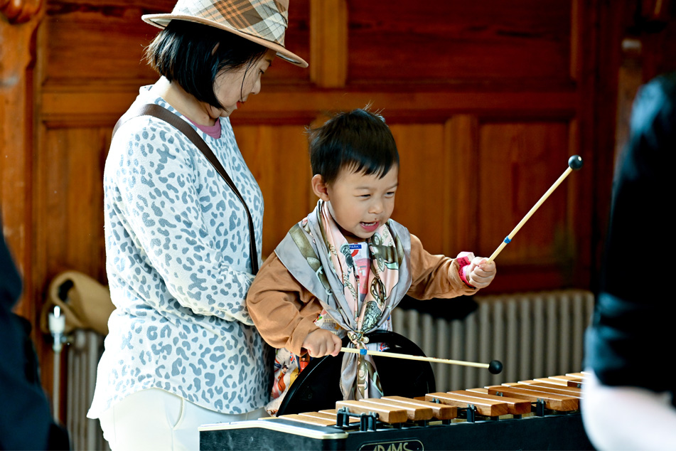 Young musicians performing on a range of instruments including drums and the recorder