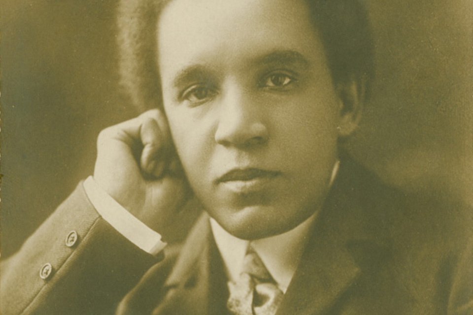 An old photo of Samuel Coleridge-Taylor resting his chin on his hand
