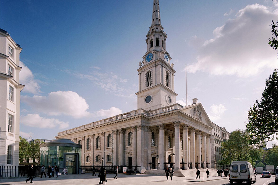 The external of St Martin-in-the-Fields' church building with its impressive spire under a blue sky