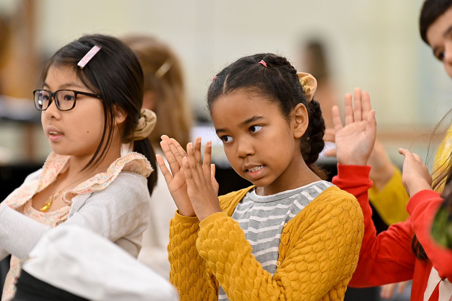 Young children clapping