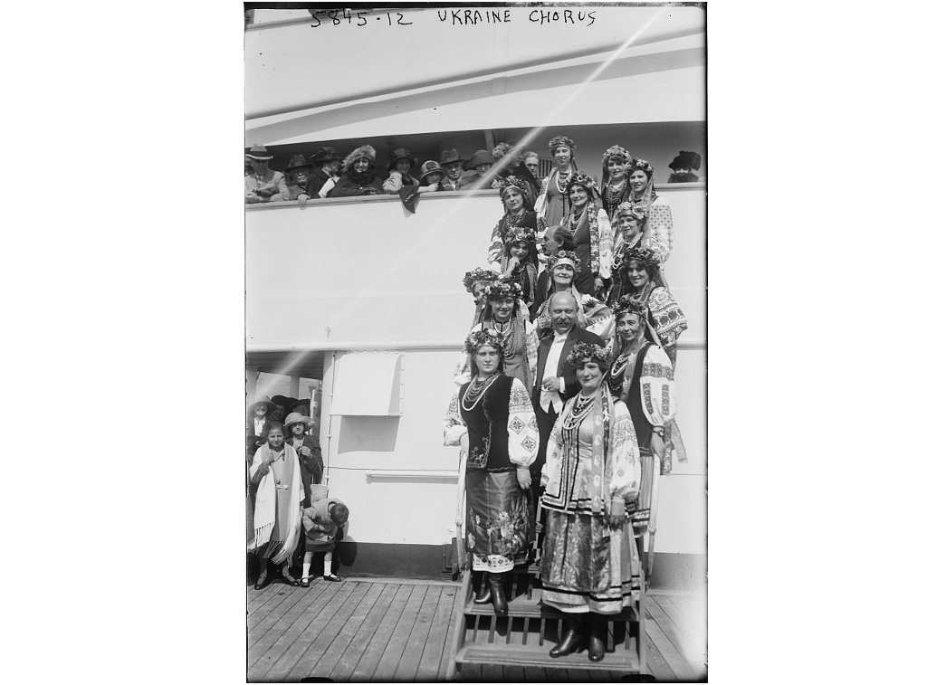 Ukranian National Chorus: a group of women in traditional Ukrainian attire disembarking a ship 